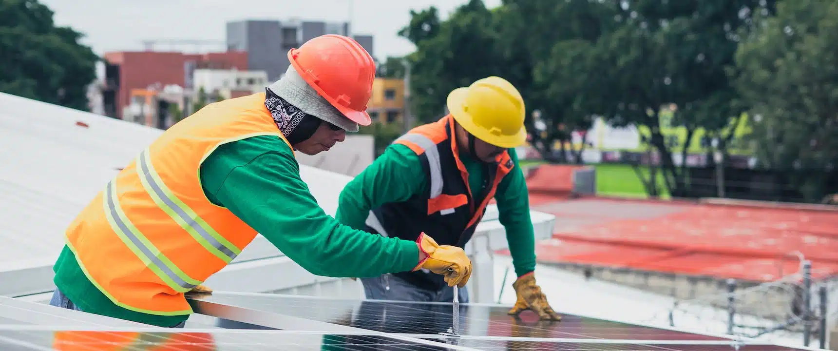 experts installing solar panel at a roof