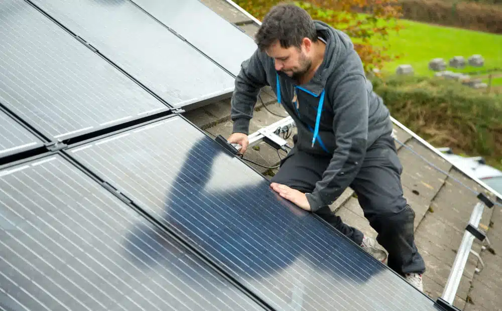 a man installing solar panel