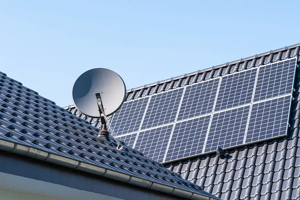 satellite dish solar panels installed on a roof