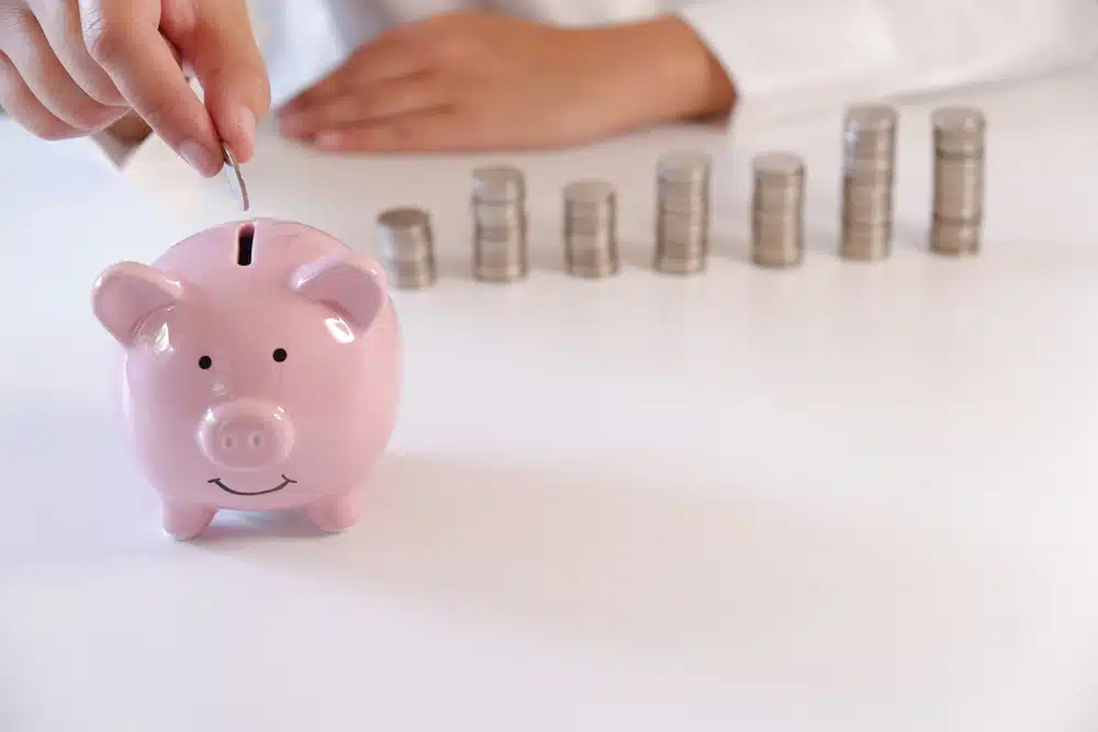 piggy bank in saving up money by installing ev charger at home