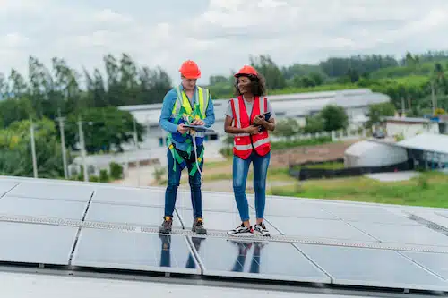 solar specialist doing maintenance check on solar panels